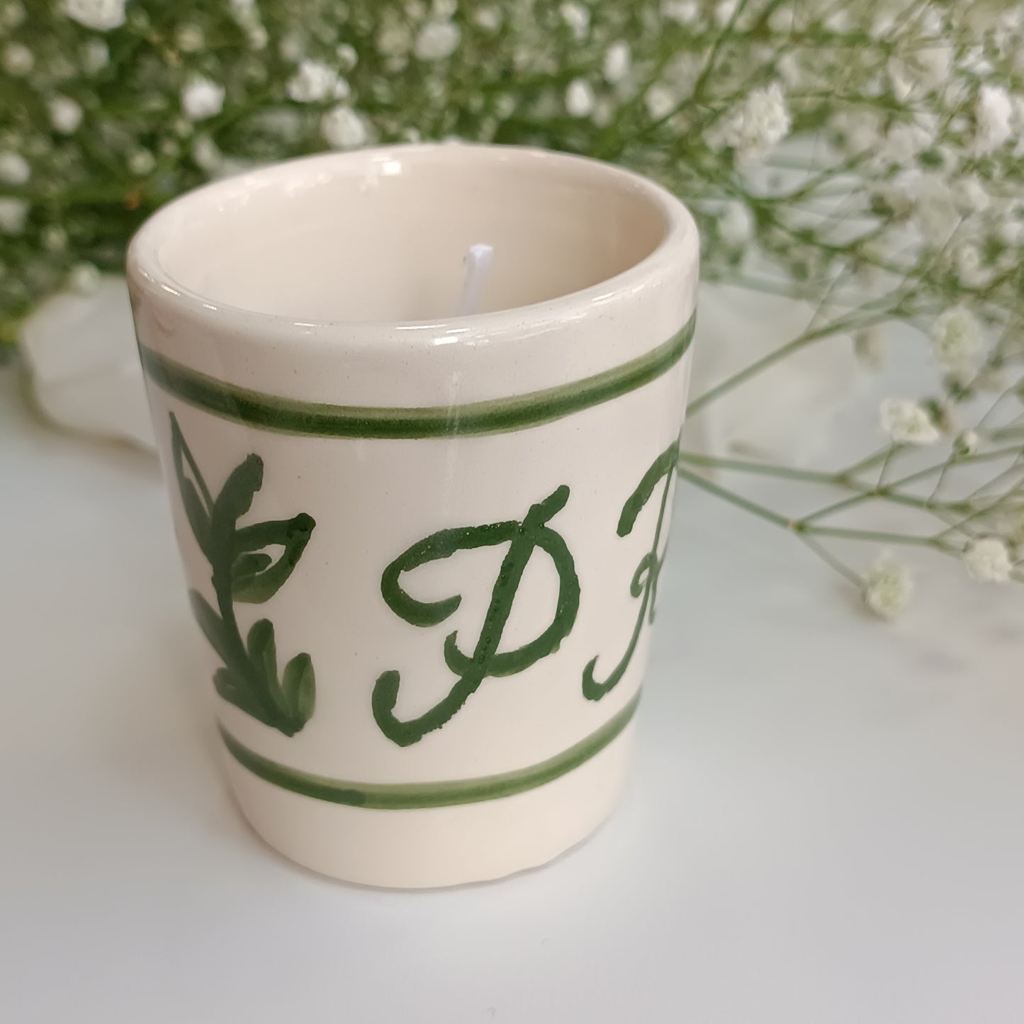 Vela en base de cerámica